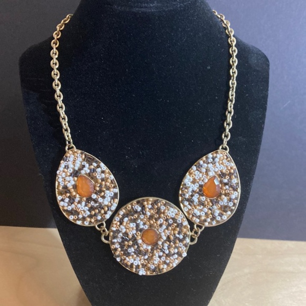 Awesome varied brownish hue beaded embellished necklace on gold tone metal